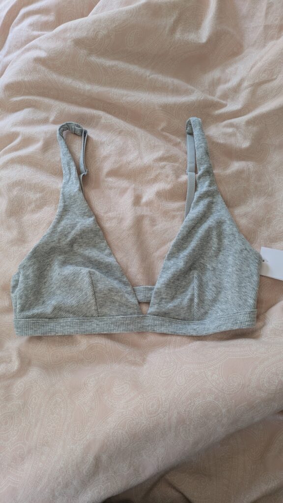 Target's cotton bralette in gray on the bed. 