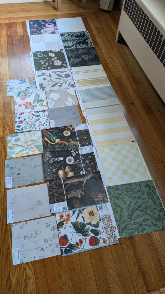 a row of removable peel and stick wallpaper on the floor
