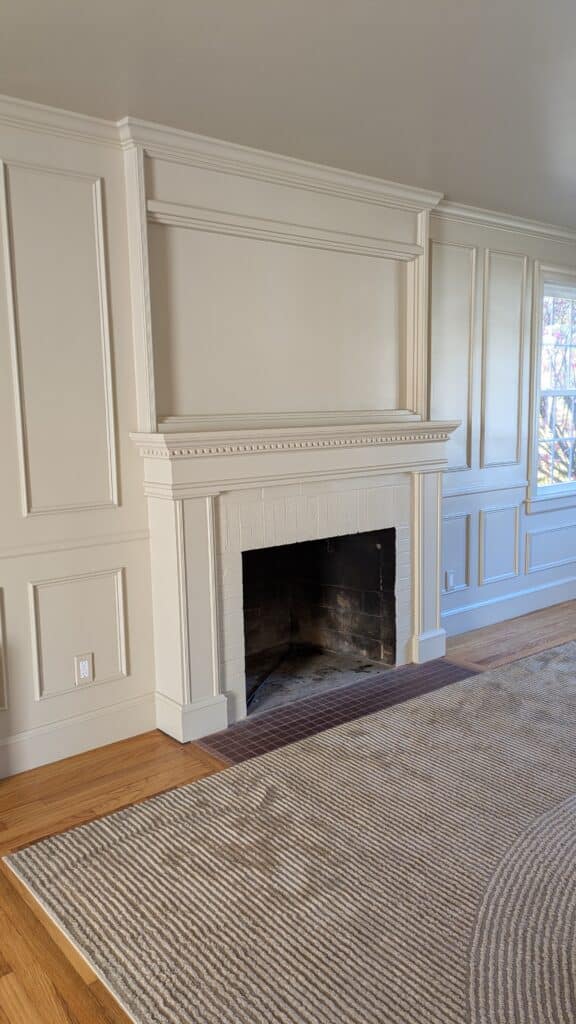 Color drenched living room DIY makeover showing off the new warm honey toned paint color. 