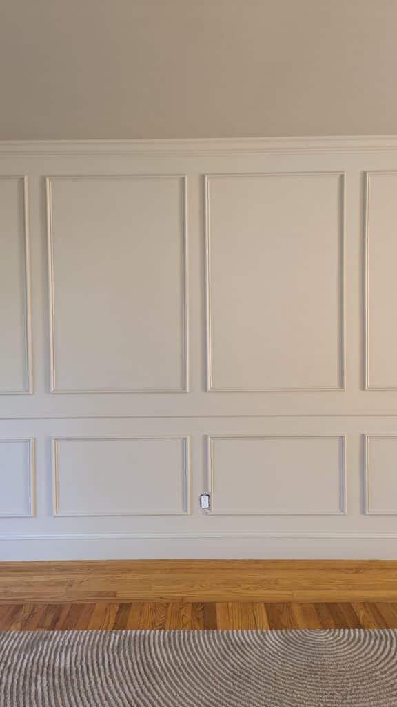 color drenched warm honey paint and box trims on a wall. 